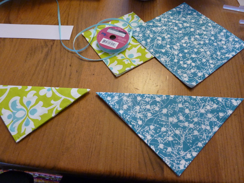 The napkins on the table in blue and blue and green.