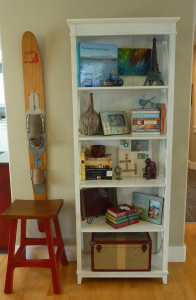 Bookshelf with items on it.