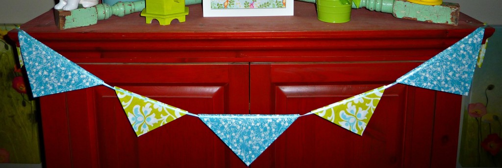 There is a spring banner strung across the sideboard.