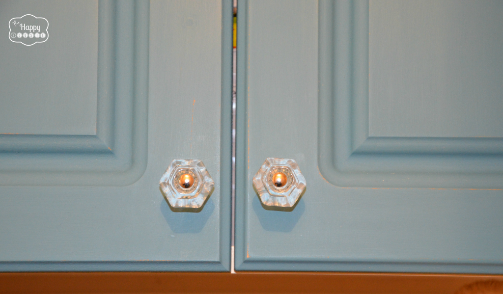 Glass knobs on the cabinets in the laundry room.