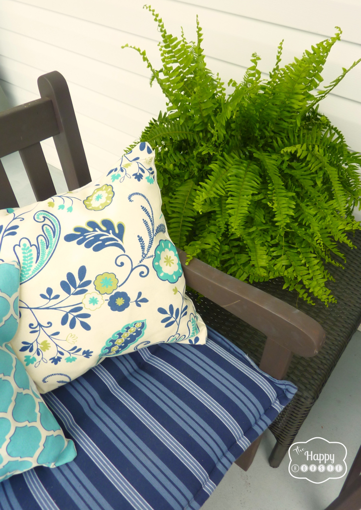 Blue striped and floral cushions on the patio chairs.