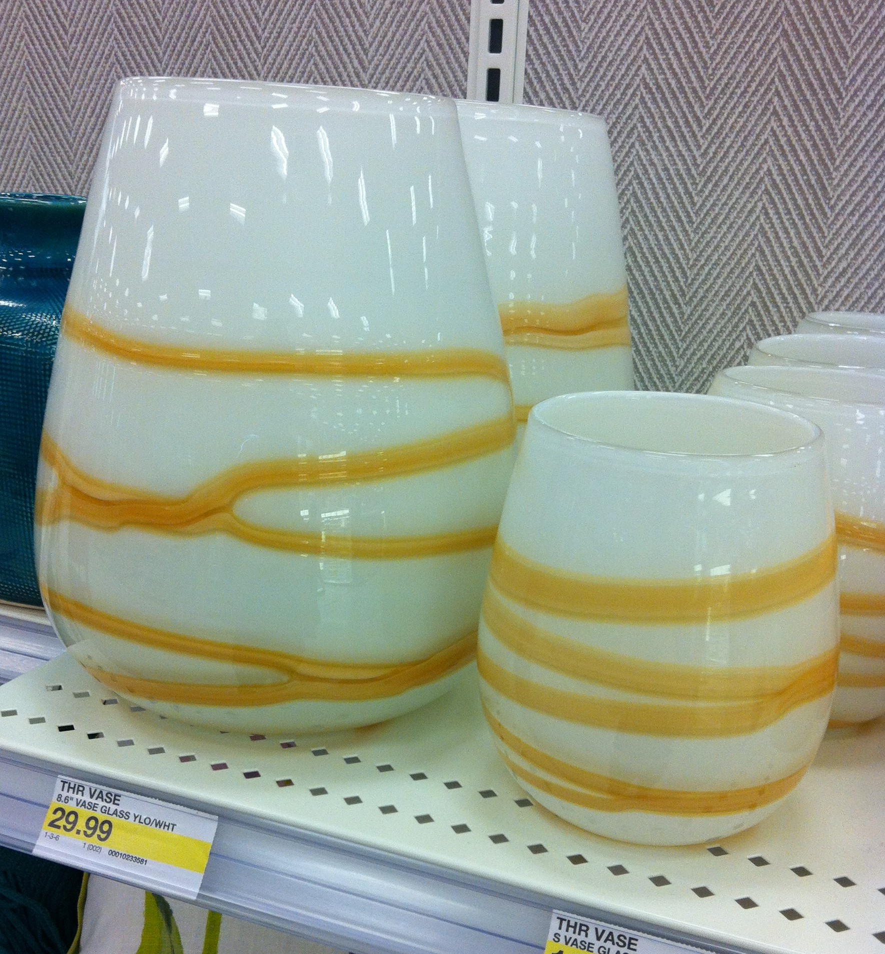 Target yellow vases on the shelf.