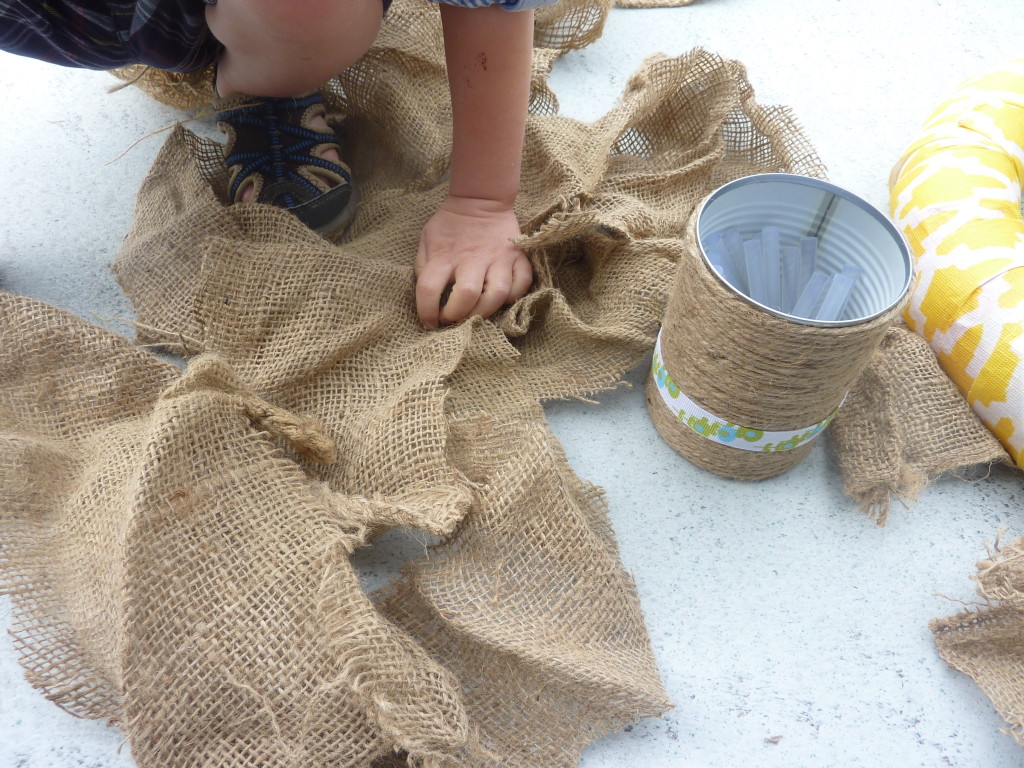 Wrapping the pool noodle in burlap.