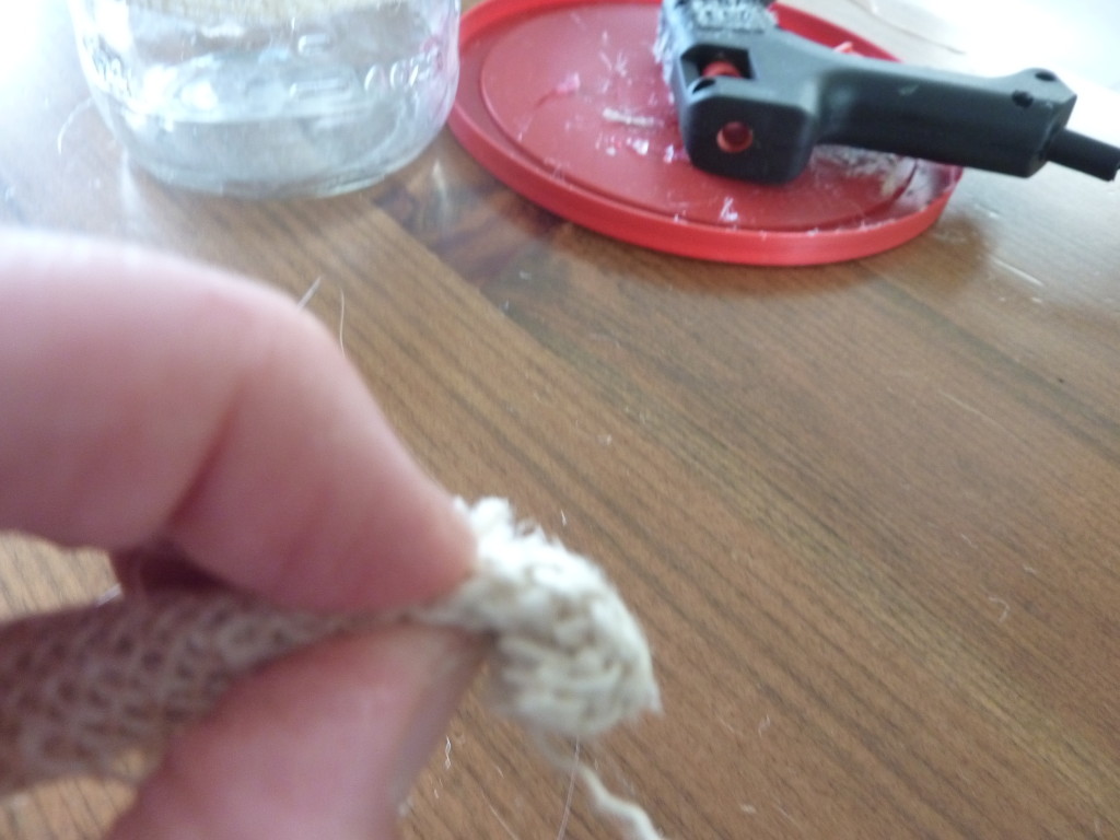 The hot glue gun with a small piece of burlap.