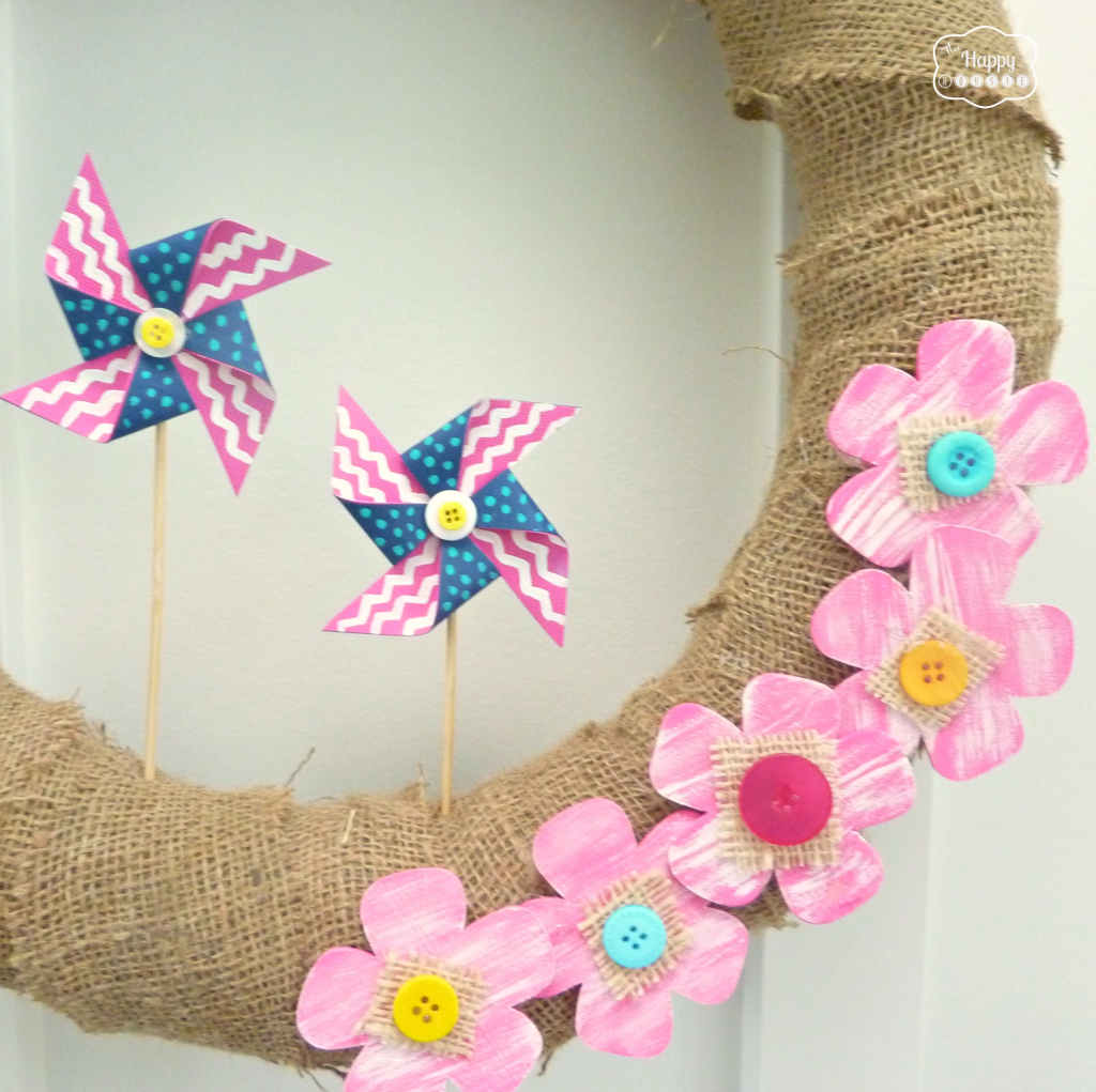 The burlap wreath with pinwheel and flowers.