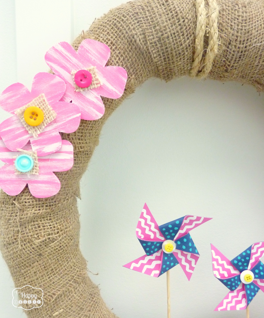 Up close picture of the pink flowers on the wreath.