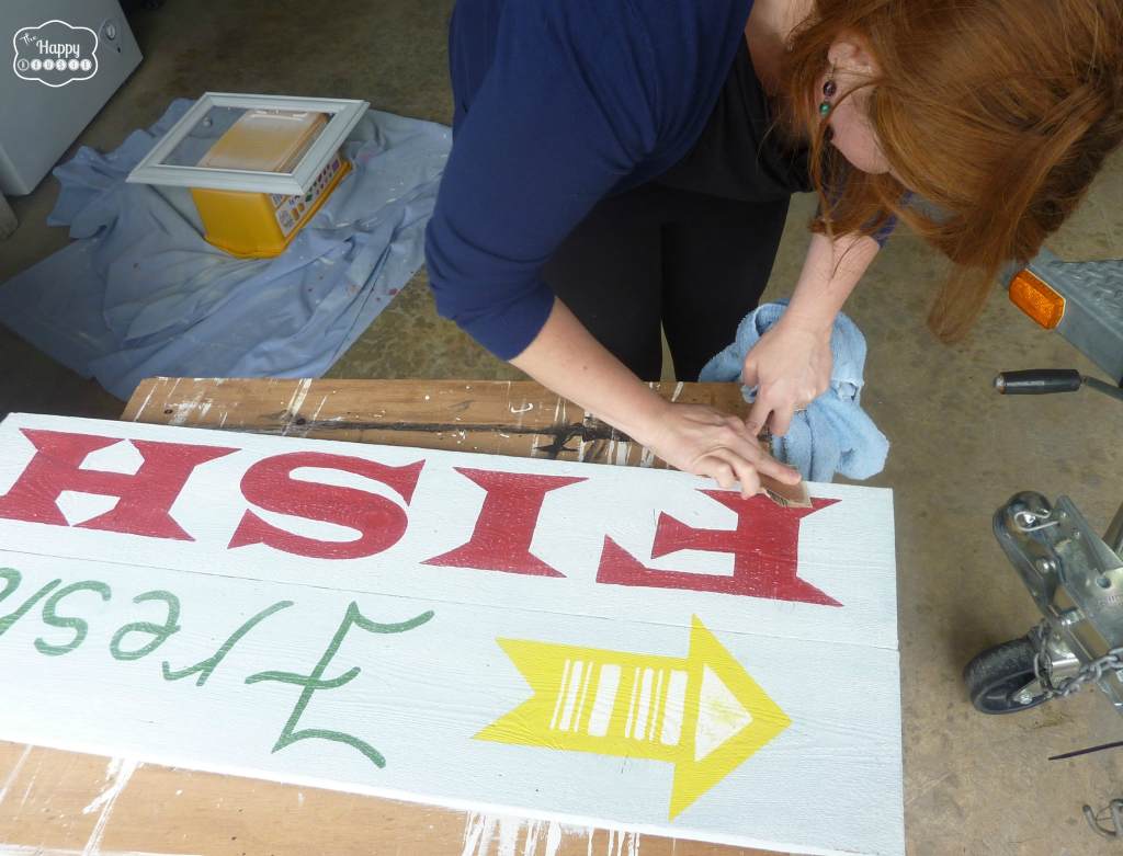 Painting the sign.