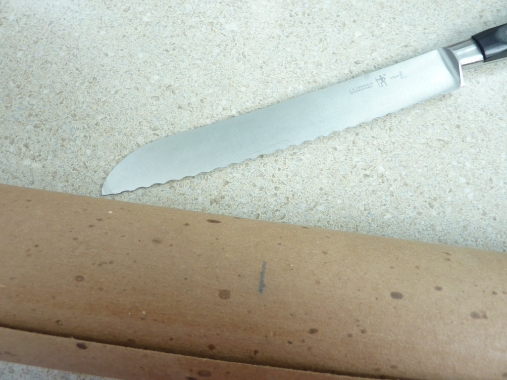A serrated knife on the table.