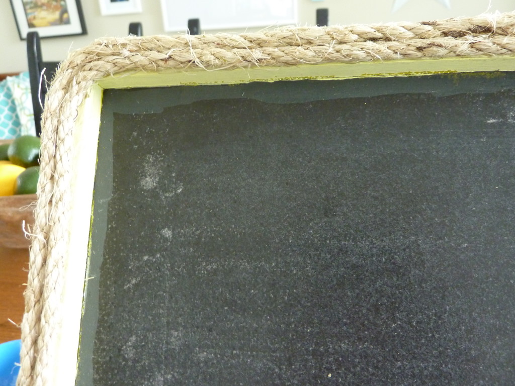 A chalkboard with the rope around it.