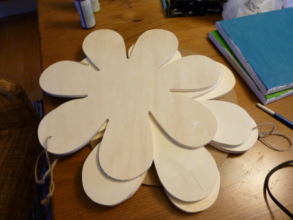 Cut out wooden flower pieces.