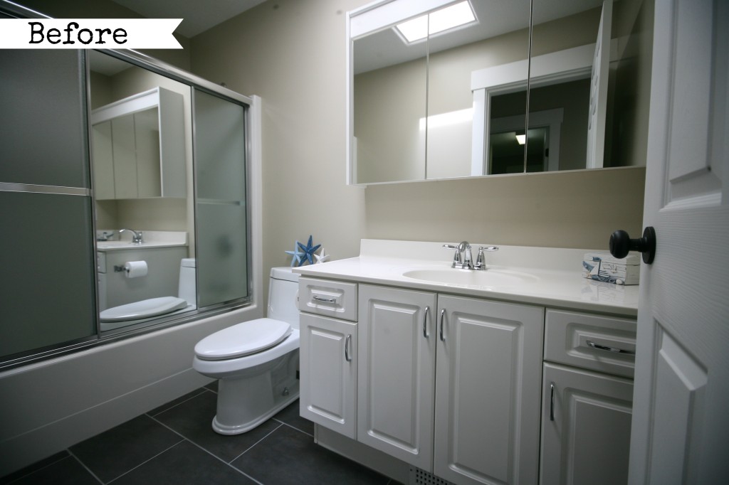 Main bath before with white cabinets.