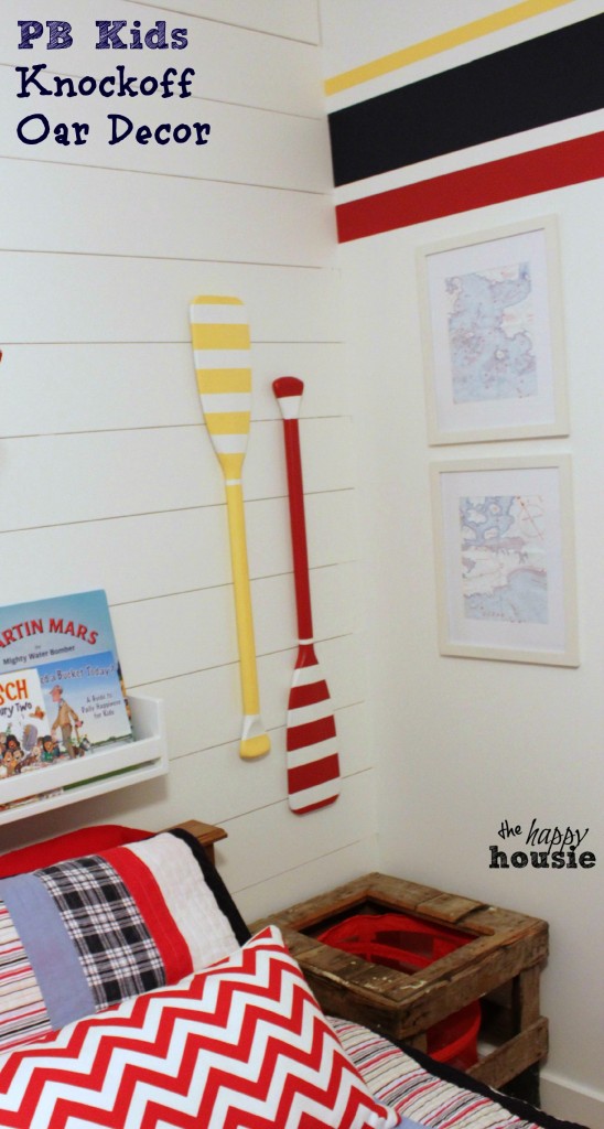 Pottery Barn Kids Knockoff Oar Decor on the planked wall in the kids room.