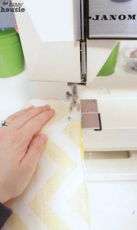 Sewing the fabric together for the pillow.