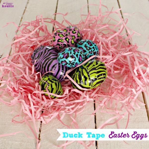 Duck Tape Easter Eggs in a bed of pink shredded paper.