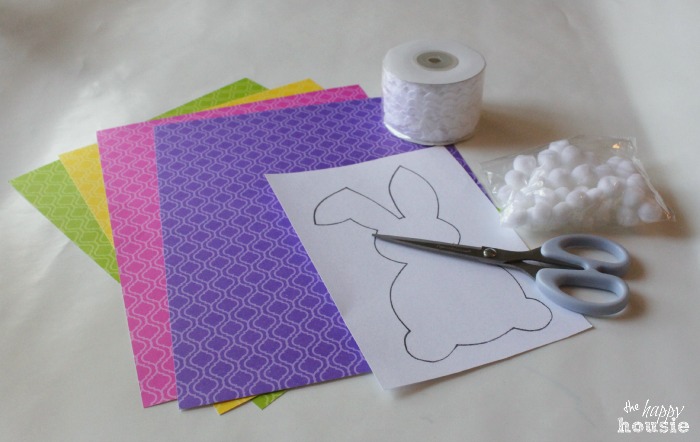 The colourful paper and supplies to make the bunting.