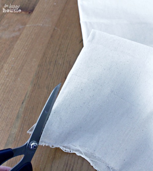 Cutting the drop cloth.
