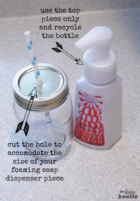 Cutting a hole in the top of the mason jar and inserting a straw.