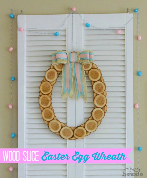 Wood slice Easter wreath hanging up in the house.