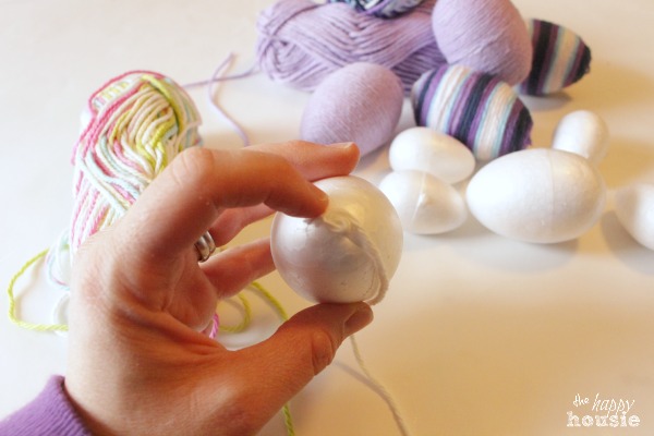 Wrapping the yarn around the egg.