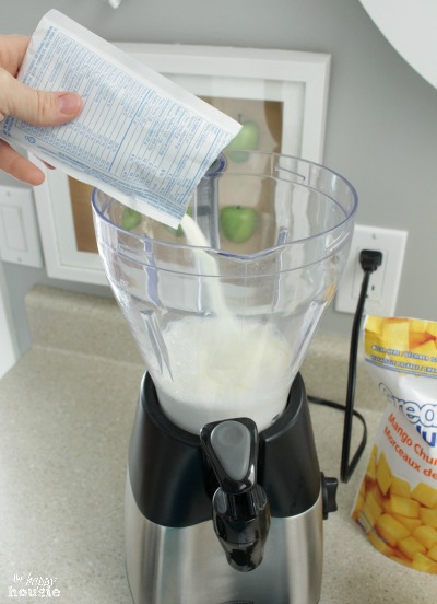 Pouring the ingredients into the blender.