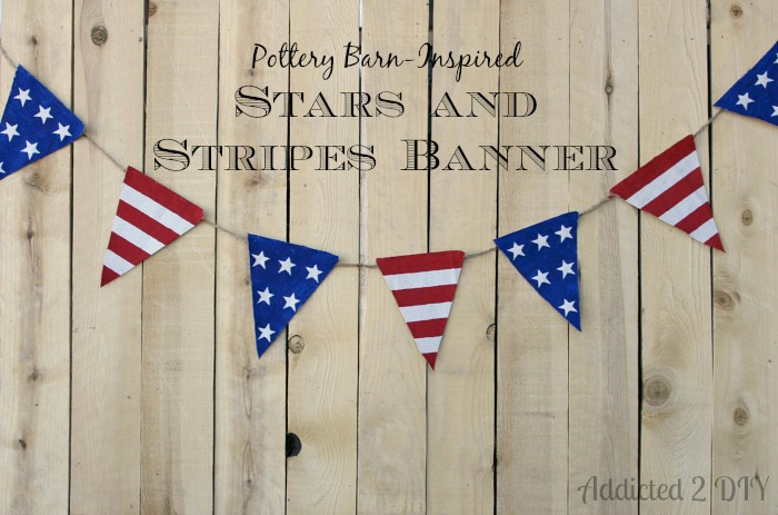 A Stars and Stripes banner hanging on a wooden wall.