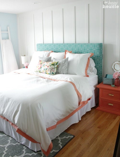 White and peach bedding in the bedroom.