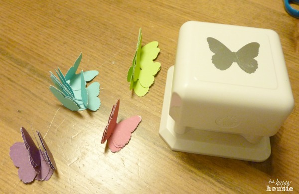 A butterfly punch with yellow, blue, purple and pink butterflies cut out.