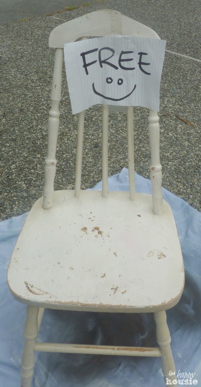 The free chair that is white and very worn.