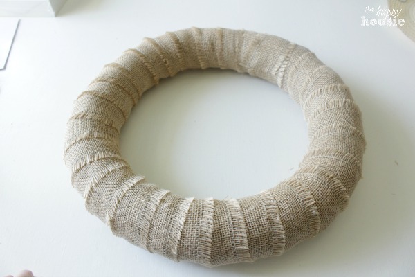 The wreath all wrapped up in burlap.