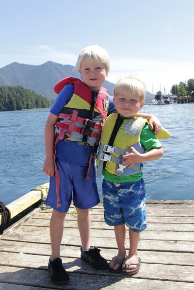 Two boys standing on the dock.
