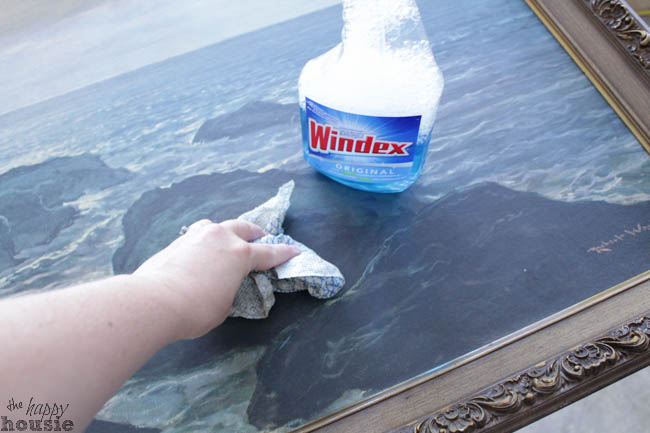 Wiping the picture with Windex.