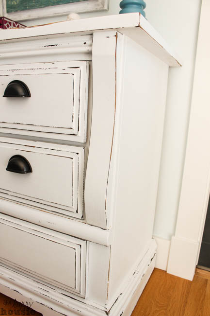 A side view of the white chalky painted dresser.