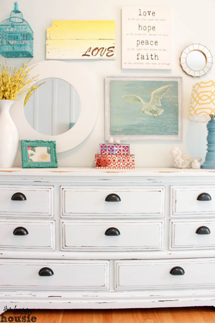 White Distressed Chalky Paint Dresser with a lamp and mirror.