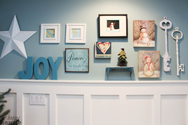 A JOY sign and a star hanging on the wall.