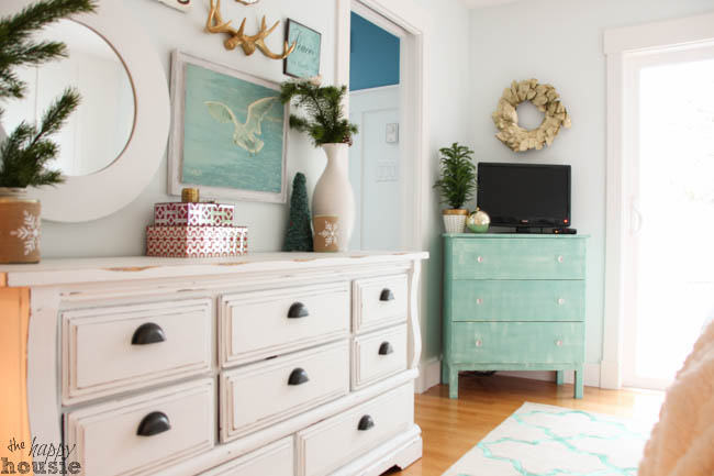 A large white dresser is in the master bedroom.