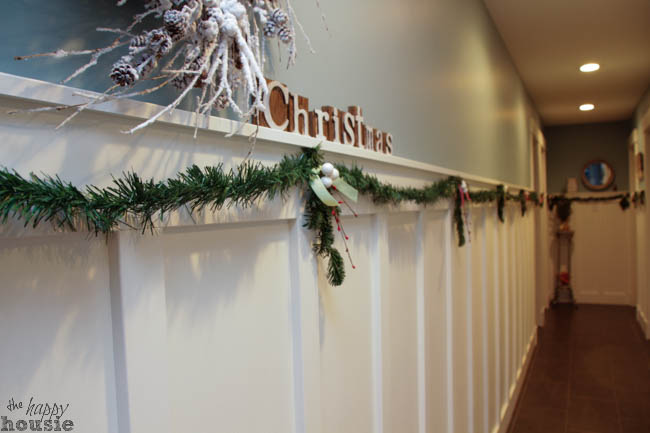 A picture of the long hallway that is decorated.