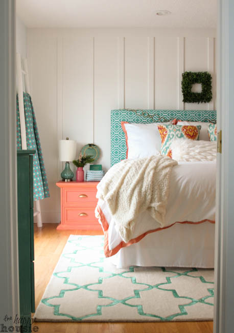 A teal and peach bedroom.