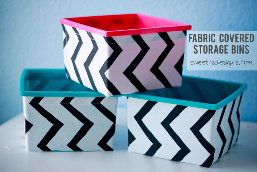 No Sew Covered Fabric Bins that are stacked up with pink and blue and zig zag black and white stripes.