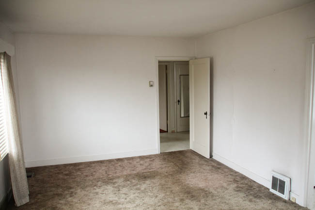 An empty room with carpet.