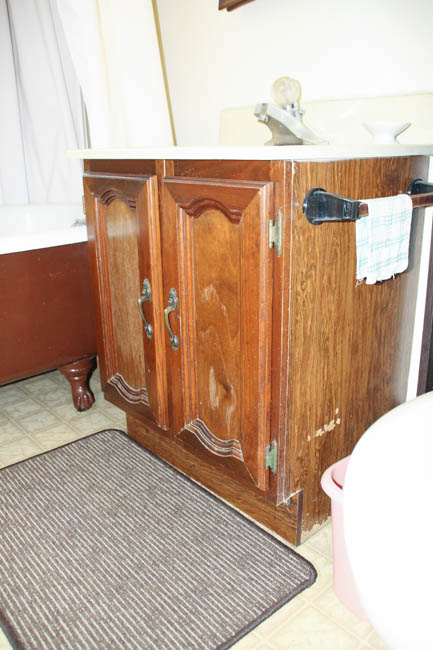 An 80's wooden bathroom cabinet.