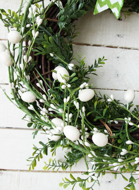 Up close picture of the white Easter eggs on the wreath.