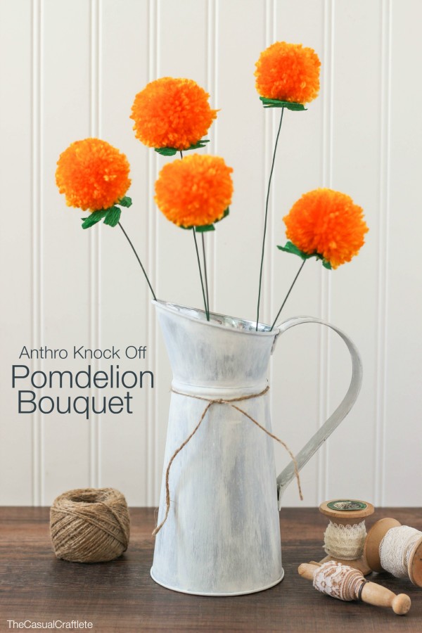 Pomdelion bouquet in a white vase.