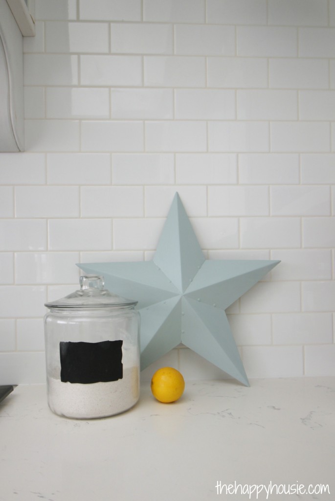 There is a light blue star and a lemon on the counter in the kitchen.