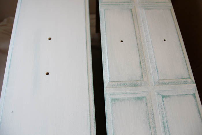 The distressed painted cabinet.
