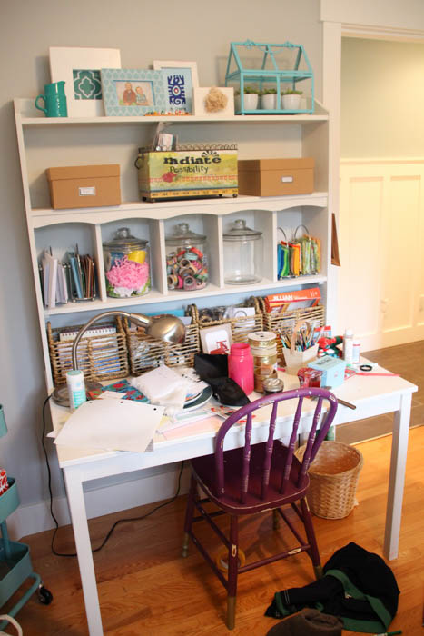 Messy desk in craft room before the makeover.