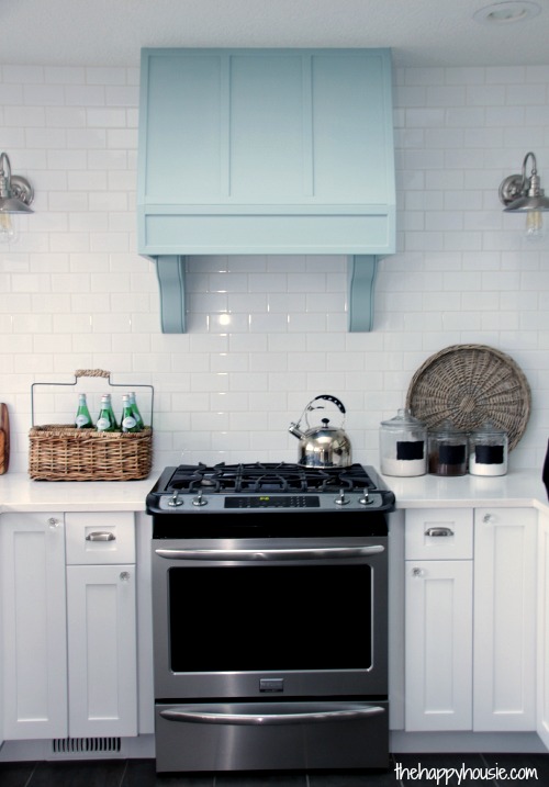 The white kitchen and aqua hood fan.