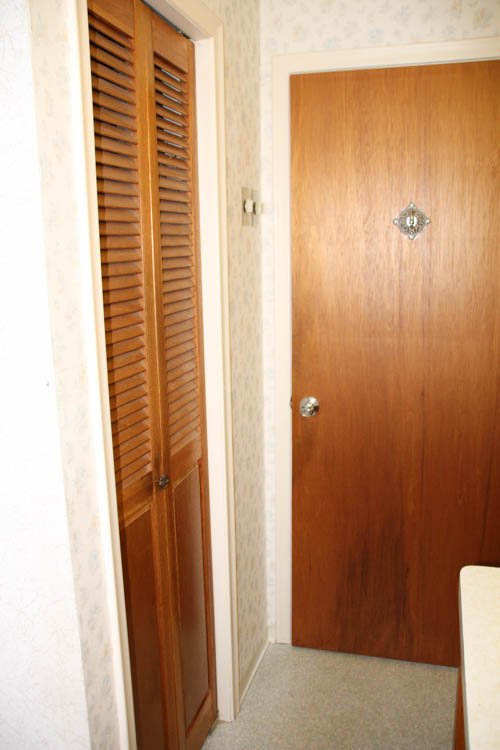 Another wooden closet door.