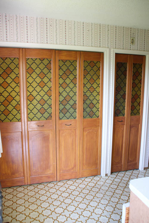 More cabinet doors that are wood with amber glass.