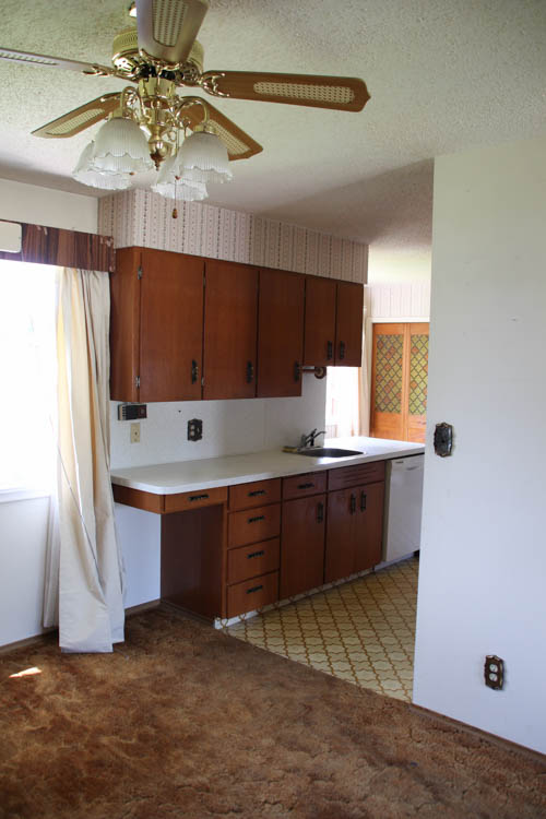 The kitchen with wooden cabinets.