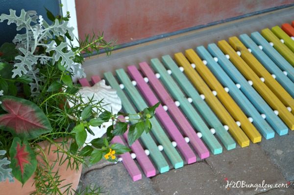 A colorful wooden door mat.
